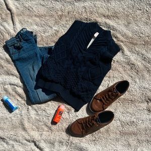 Navy blue sherpa lined vest. Partial zip, 2 front pockets. Size 6/7.